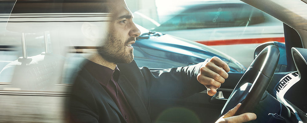 a man driving a car